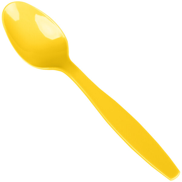 A yellow heavy weight plastic spoon.
