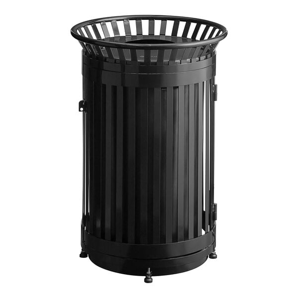 A large, round, black steel slatted outdoor trash can with a flat lid and door.