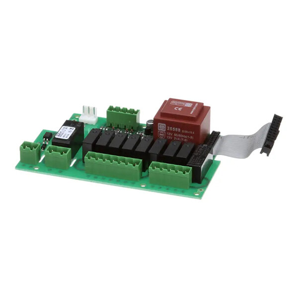 A green electronic circuit board with multiple connectors, relays, and a ribbon cable, used for boiler control in manual systems.