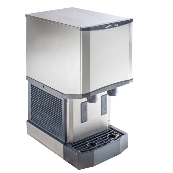 A stainless steel countertop nugget ice machine and water dispenser with hands-free dispensing.