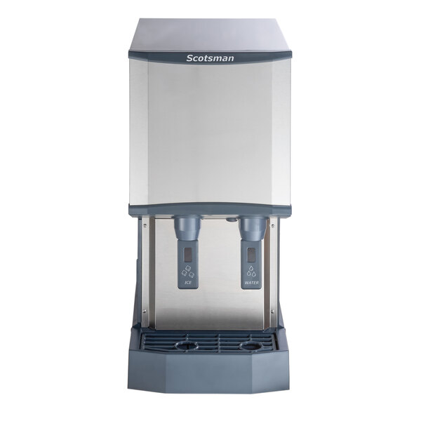 A countertop Scotsman Meridian air-cooled nugget ice machine and water dispenser with hands-free dispensing and a 12 lb. bin capacity.