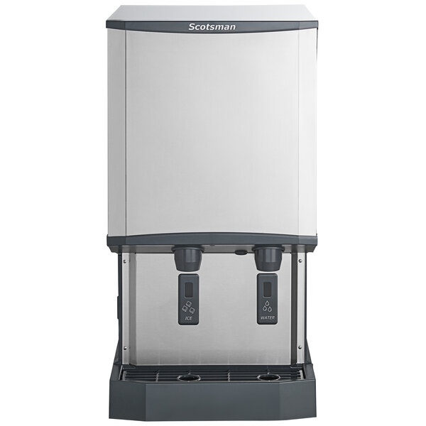 A stainless steel countertop nugget ice machine and water dispenser with hands-free dispensing and a 40 lb. bin capacity.
