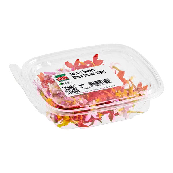 A clear plastic container of Fresh Origins Micro Orchid edible flowers.