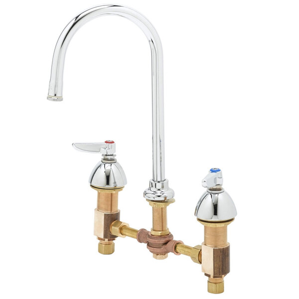 A chrome T&S deck mount faucet with a gooseneck spout and pedal valve connection.