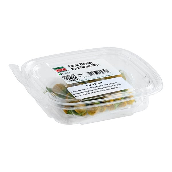 A clear plastic container of Fresh Origins Buzz Button edible flowers.