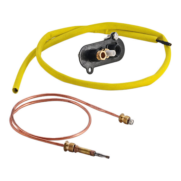A gas tandoor spare parts kit including a yellow hose, a fitting assembly, and a copper thermocouple.