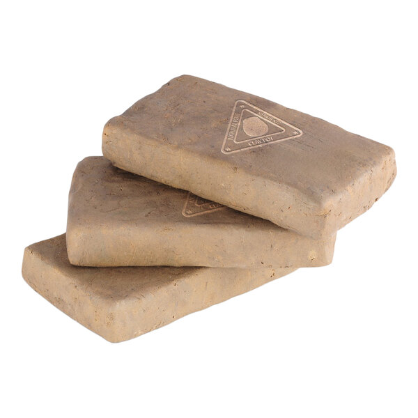 A stack of three rectangular clay mitti bricks used for tandoor repair.
