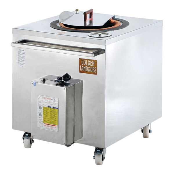 A stainless steel liquid propane tandoor oven on wheels with a top opening and control box.