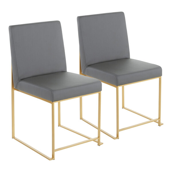 A pair of gray faux leather high back side chairs with gold brushed stainless steel frames.