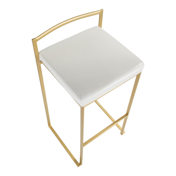 A gold steel barstool with a low back and a white faux leather seat.