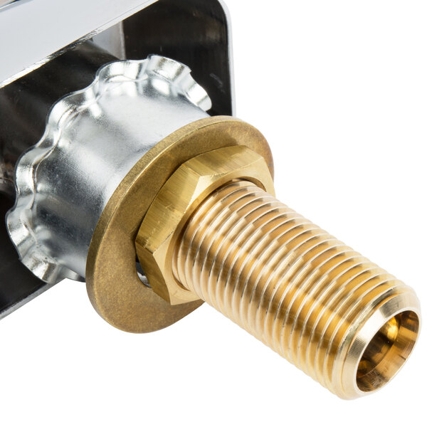 A gold and silver deck mount faucet with a swing nozzle.