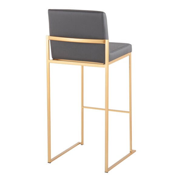 A modern barstool with a gold steel frame and a gray faux leather back and seat.