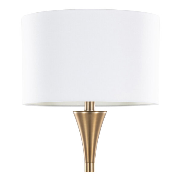 A matte golden bronze metal floor lamp with a white linen drum shade.