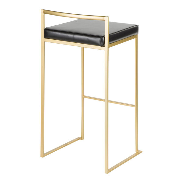 A gold steel barstool with a low back and a black faux leather seat.