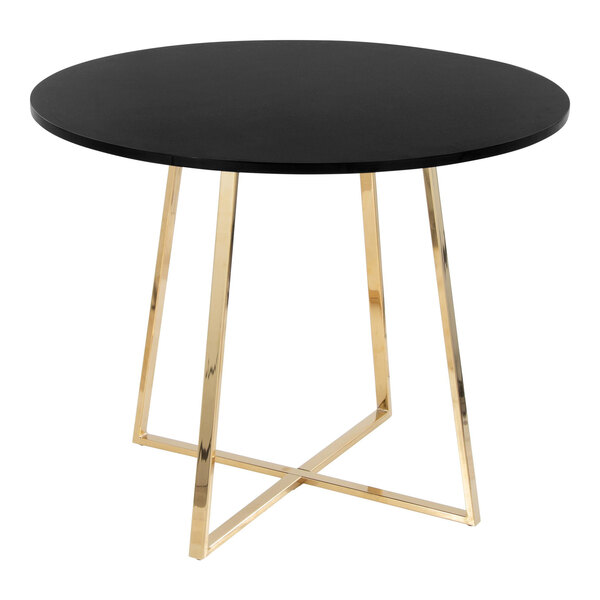 A round black dining table with a gold metal base.