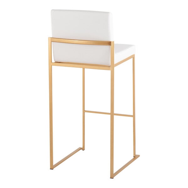 A modern barstool with a gold steel frame and a white faux leather back and seat.