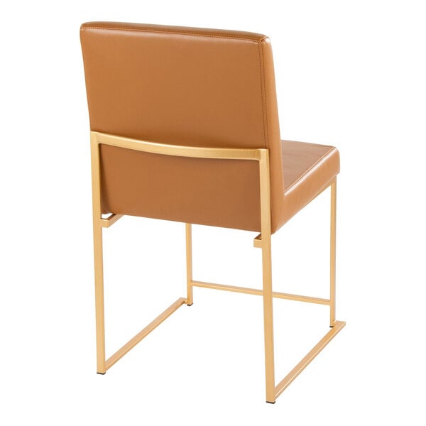 A high back side chair with camel faux leather upholstery and a gold metal frame.