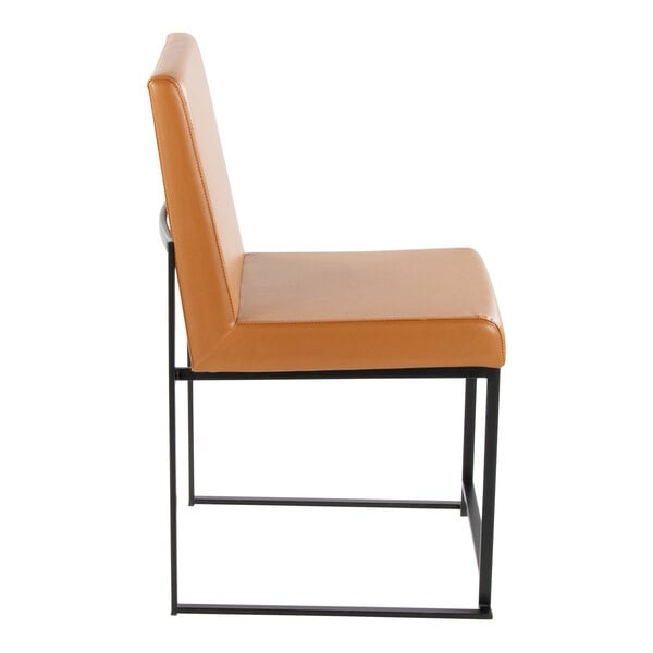 A modern side chair with camel-colored faux leather upholstery and a black metal frame.