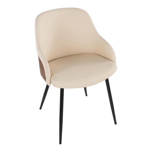A modern armchair with cream faux leather upholstery, black metal legs, and walnut wood accents.