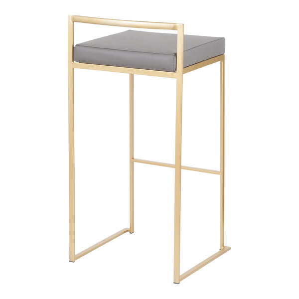 A modern barstool with a gold steel frame and a gray faux leather seat.