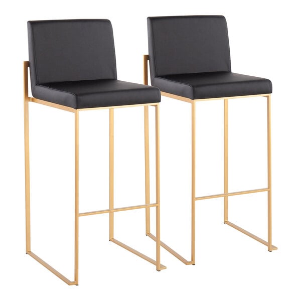 A pair of high-back barstools with black faux leather seats and gold steel frames.
