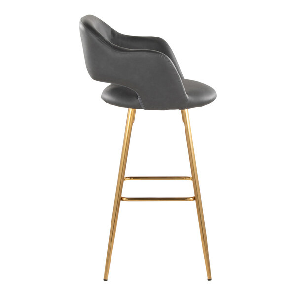 A modern barstool with a gray faux leather bucket seat, armrests, and gold metal legs.