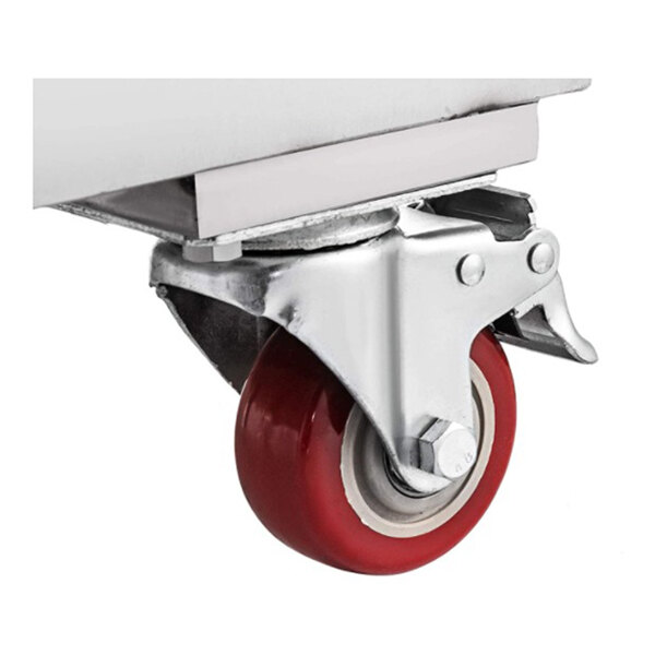 A red and silver caster wheel attached to the bottom of a stainless steel structure.