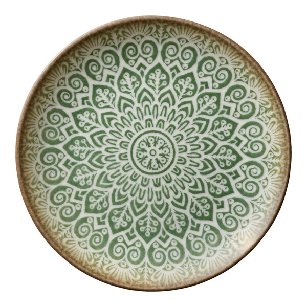 A round jade porcelain coupe plate with an intricate green and white mandala pattern.