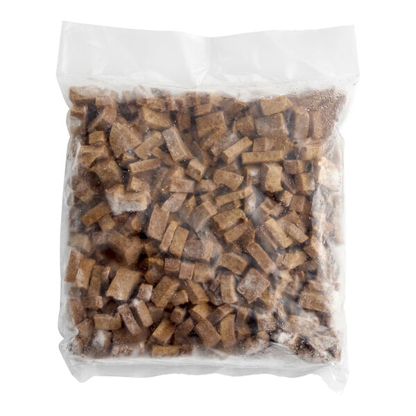 A sealed plastic bag containing frozen plant-based steak bites.