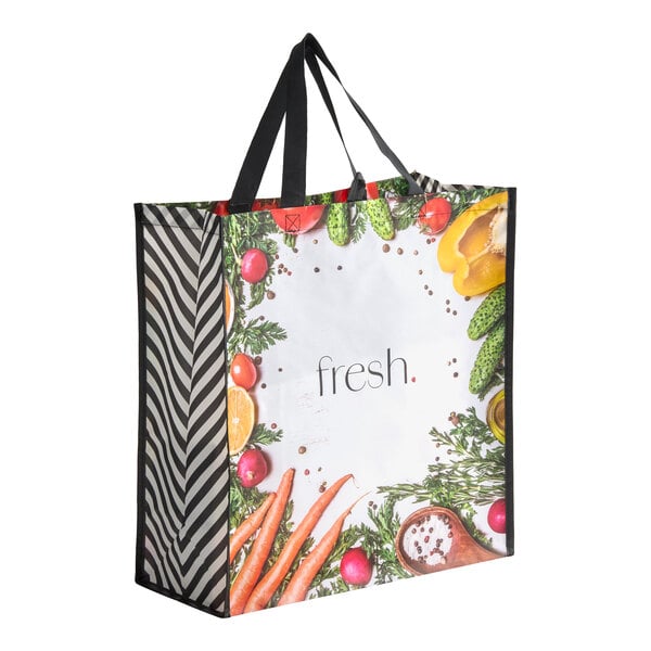A large non-woven reusable shopping bag with black handles and a 'fresh.' print surrounded by images of vegetables and herbs.
