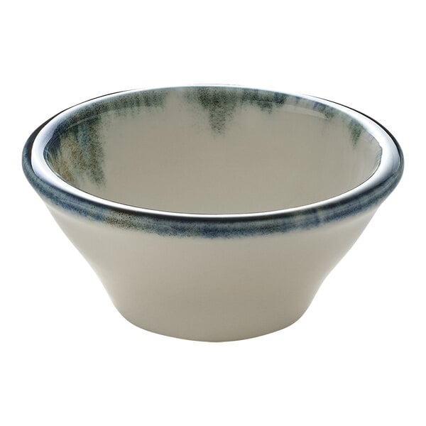 A small round white porcelain ramekin with a blue rim.