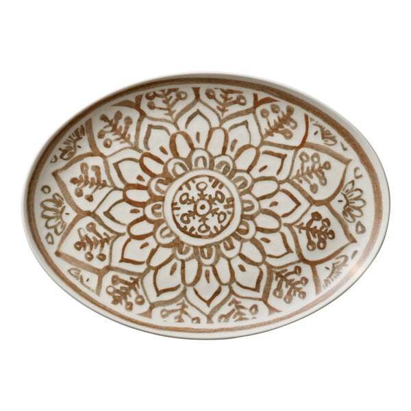 An oval porcelain platter with a brown floral and geometric pattern.