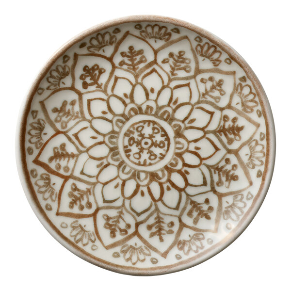 A round porcelain coupe plate with a sienna-colored floral and geometric pattern.