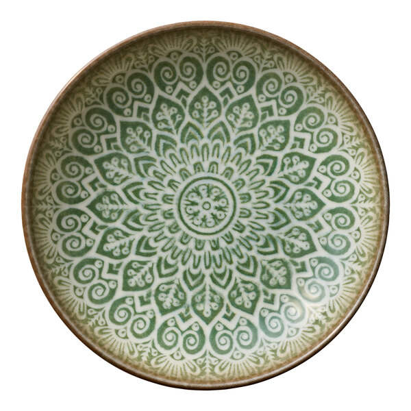 A round jade porcelain deep coupe plate with an intricate green and white mandala pattern.