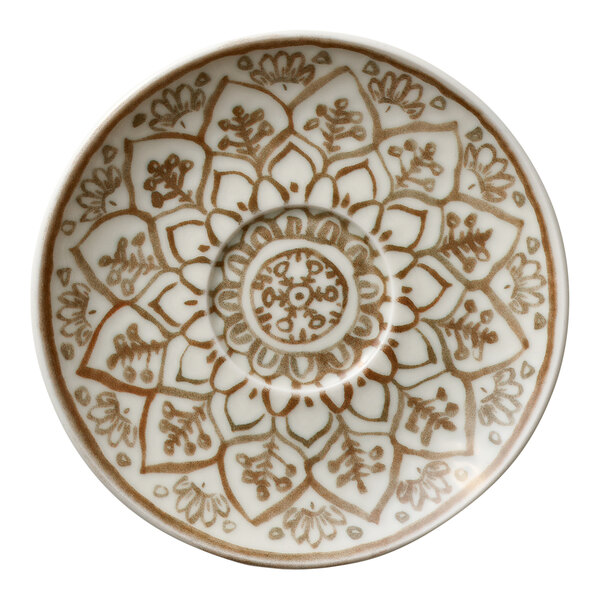 A round porcelain saucer with a brown floral and geometric pattern.