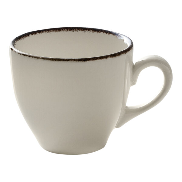 A small white porcelain cup with a brown rim and a handle.