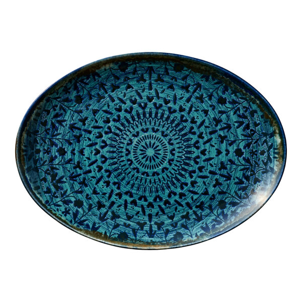 An oval blue porcelain coupe platter with an intricate geometric pattern.