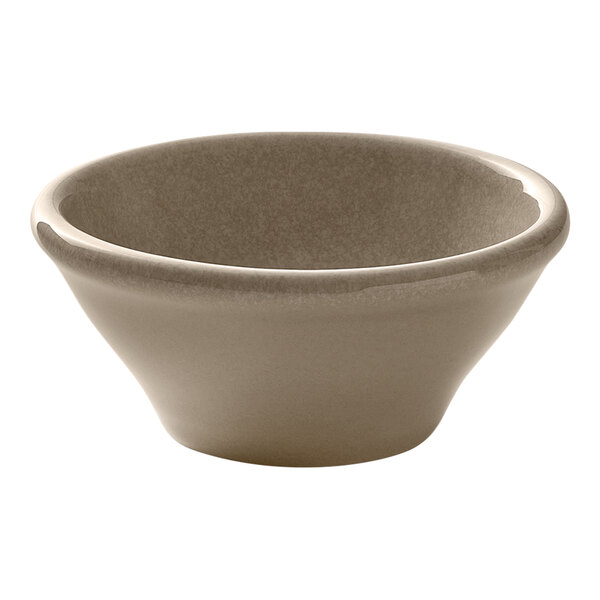 A small round almond-colored porcelain ramekin.