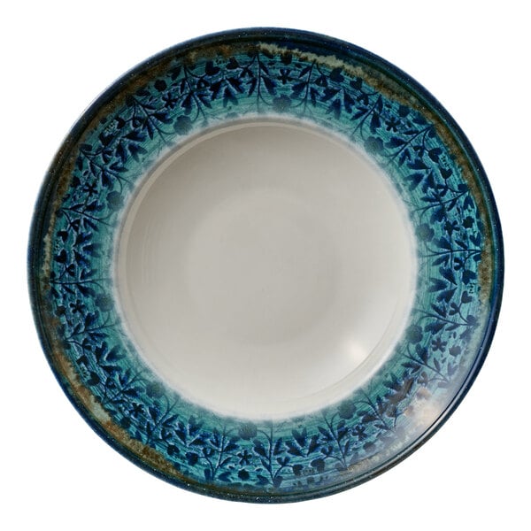 A round white deep porcelain coupe plate with a blue patterned rim.