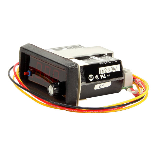 A digital temperature control display unit with attached wiring.