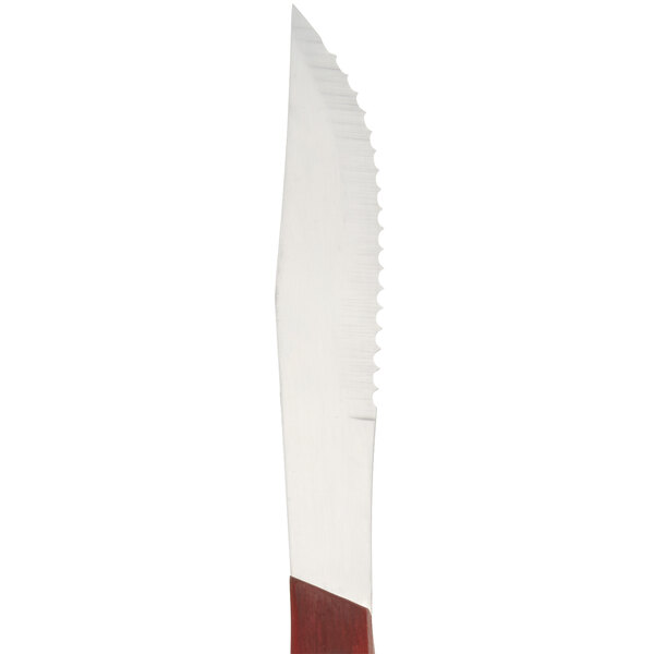 An American Metalcraft steak knife with a pakkawood handle and a red stripe.