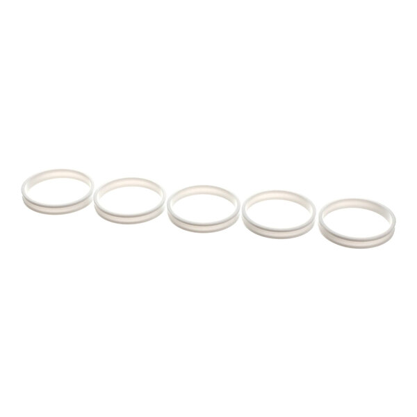 A set of five white circular egg rings.