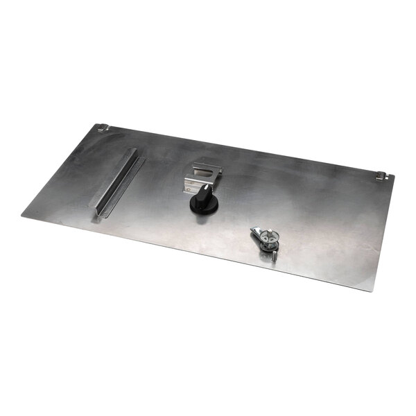 A rectangular metal front door cover assembly kit with attached handle and latch components.