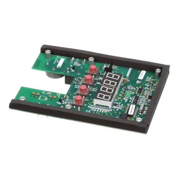 A green printed circuit board assembly with a digital display and several red buttons.