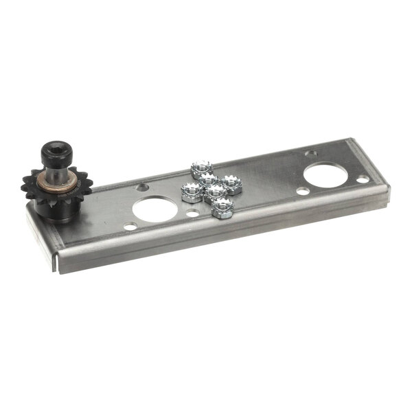 A metal bearing idler sprocket kit with a rectangular mounting plate and several small components.