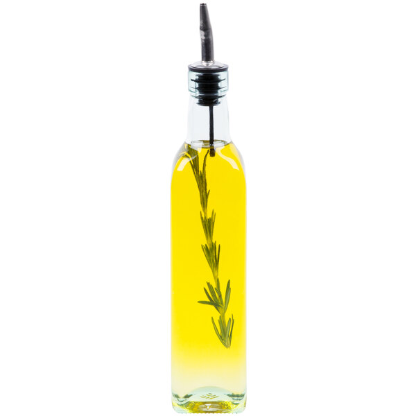 A 16 oz. glass olive oil cruet with a pourer and a sprig of rosemary inside.