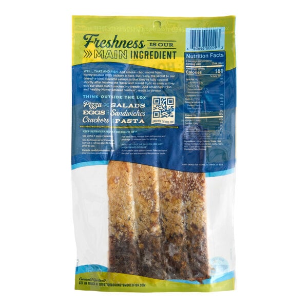 A vacuum-sealed package containing Honey Smoked Fish Co. Original Honey Smoked Salmon.