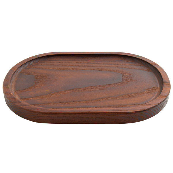 A dark brown oval ash wood rimmed serving board.