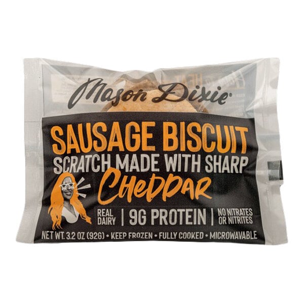 A packaged Mason Dixie sausage and sharp cheddar cheese biscuit breakfast sandwich.