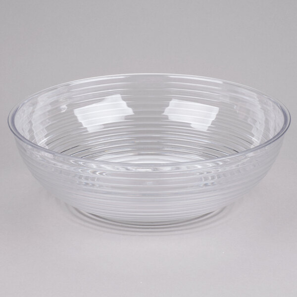A large clear round ribbed plastic bowl.